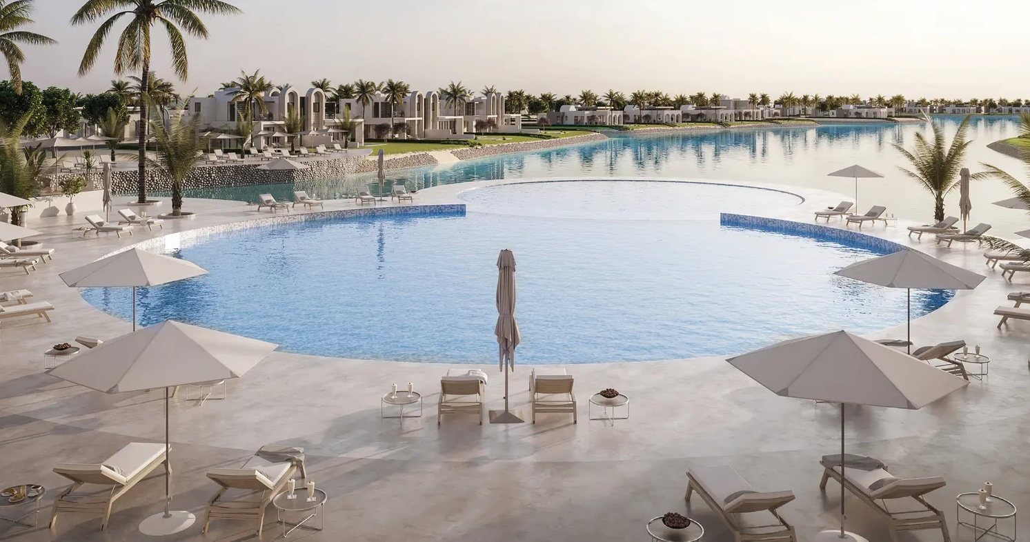 Amazi Hawana Salalah — lagoon pool with sun loungers